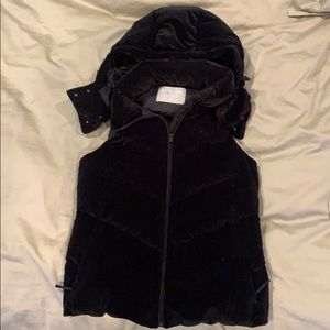 Black velvet vest with detachable hood.